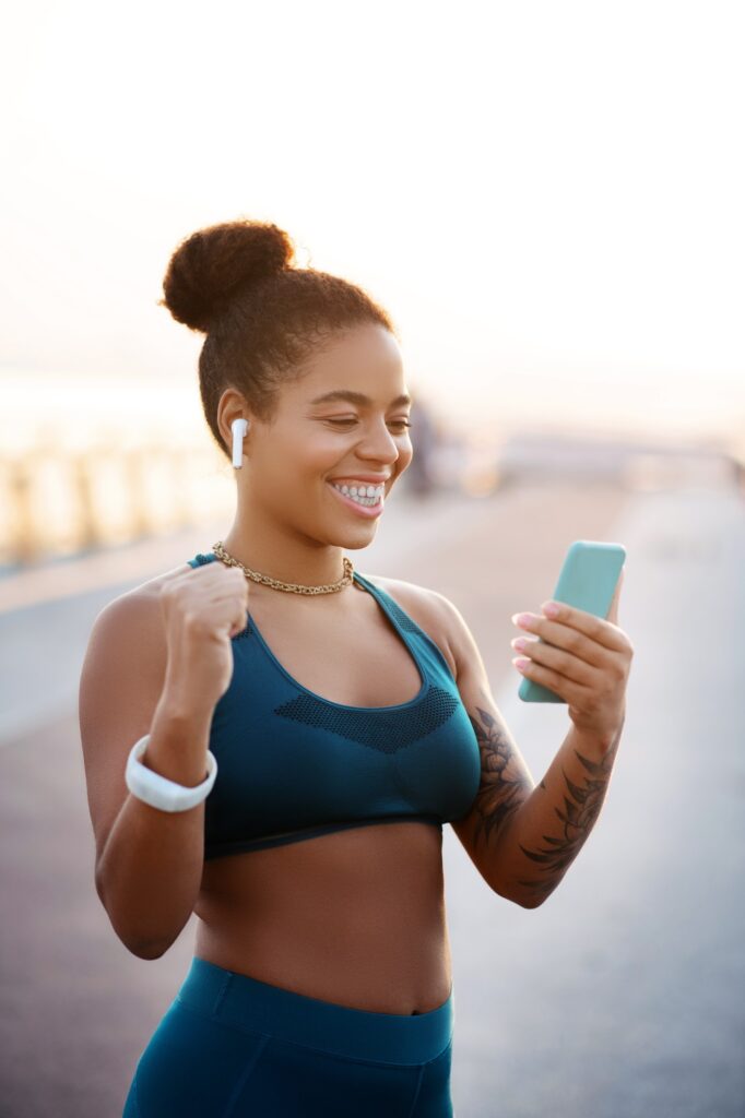 Woman feeling happy after reaching her target in weight loss